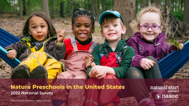 four smiling children in hammock
